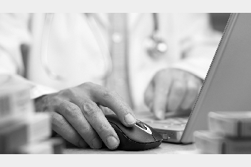 Provider's hand on a computer mouse