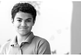 Teen Boy Smiling in Hallway