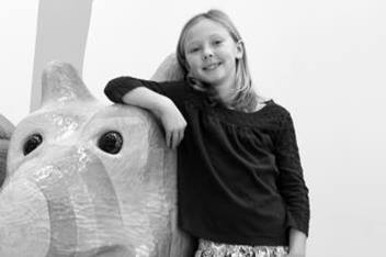 Young Girl Leaning on Animal Friend