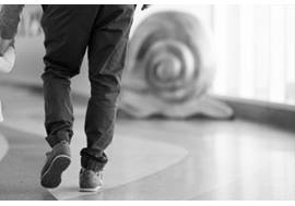 Toddler Walking in Hallway Holding Dad's Hand