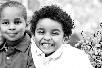 Brothers Sitting Outside Smiling