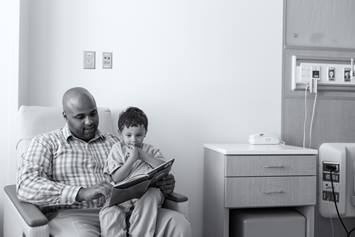 Father Reading to Patient